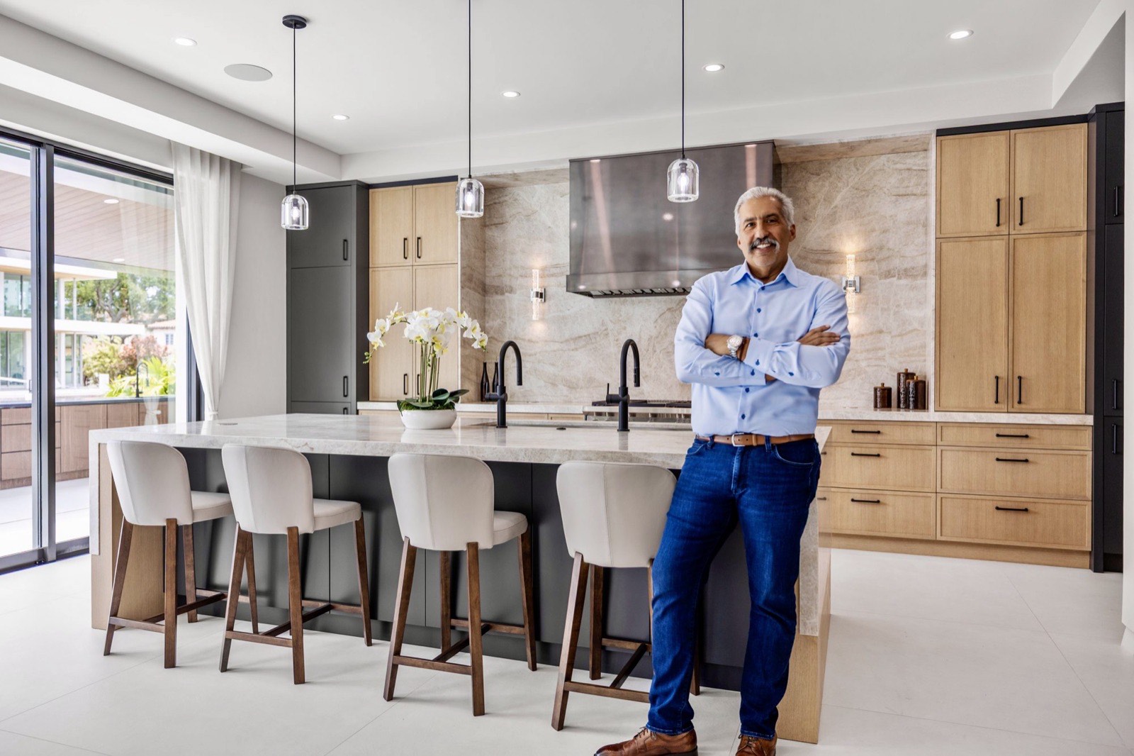 Carlos A. Calderon standing in a finished kitchen